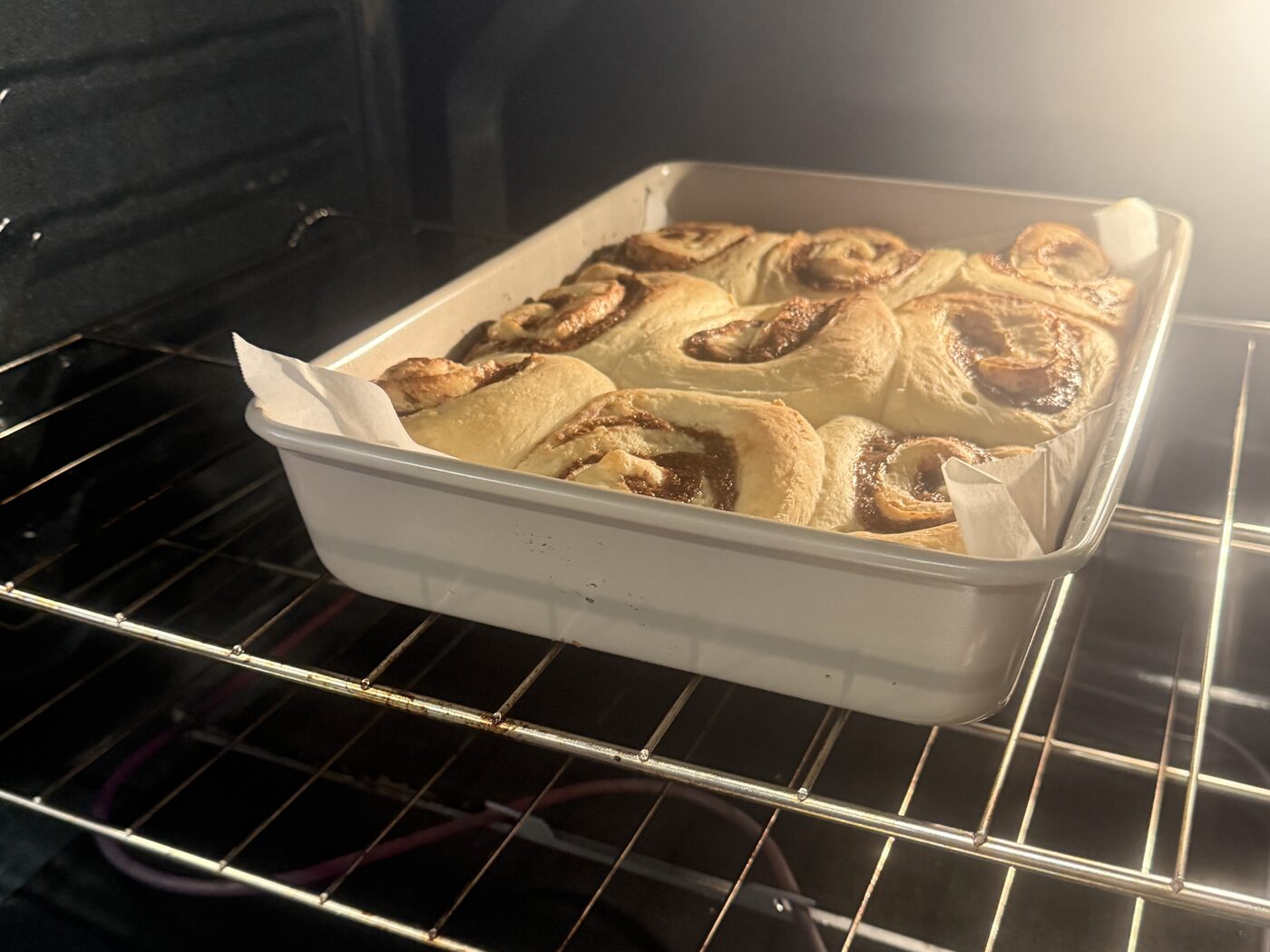 A pan of Nana&rsquo;s cinnamon buns warming in the oven